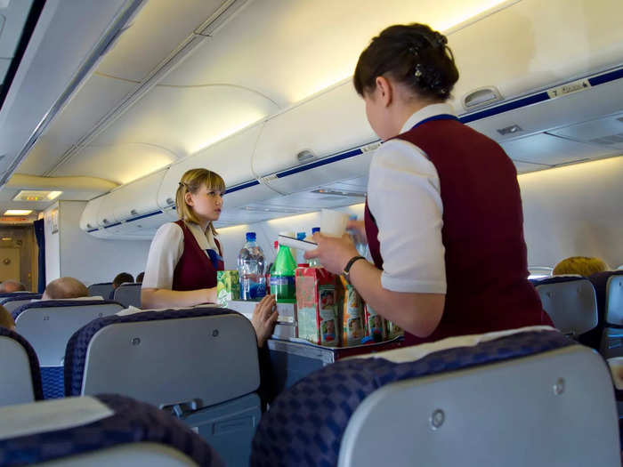 Take out your headphones when flight attendants come by for service.