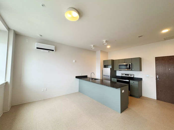 The apartment I viewed had tall ceilings and a modern kitchen.