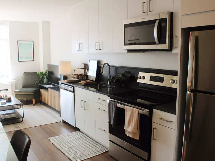 The apartment had a galley-style kitchen with modern cabinetry.