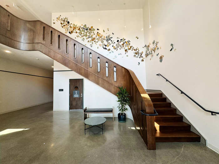 The entrance to the building was modern, with a grand staircase that gave a luxurious feel to the space.