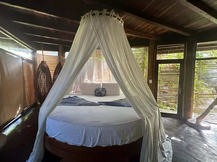 At the center of my room was a lush canopy bed flanked by a gauzy mosquito net. 