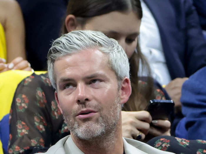 New York City real-estate broker and "Owning Manhattan" star Ryan Serhant watched a day one match in a pale-gray suit and black shirt.