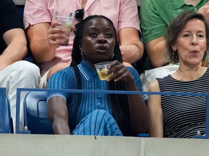 Danai Gurira enjoyed a drink as she watched the action.