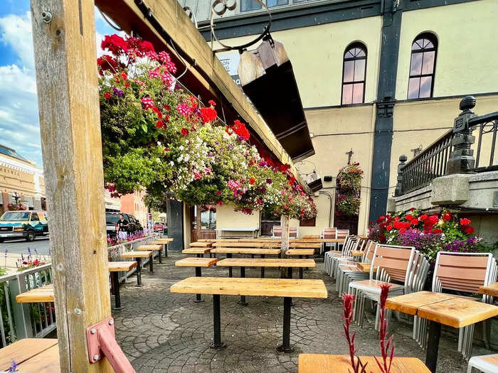 The city celebrated the arrival of summer by hanging hundreds of flower baskets around town.