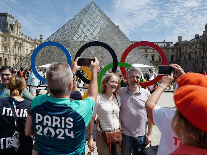 The iconic rings were placed outside the Louvre