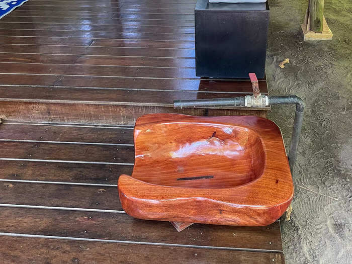 At the front of the deck was a wooden tub for washing off sandy feet. 