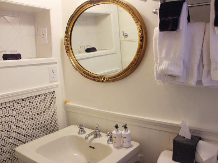 The bathroom was clean and modern, with some feminine details.