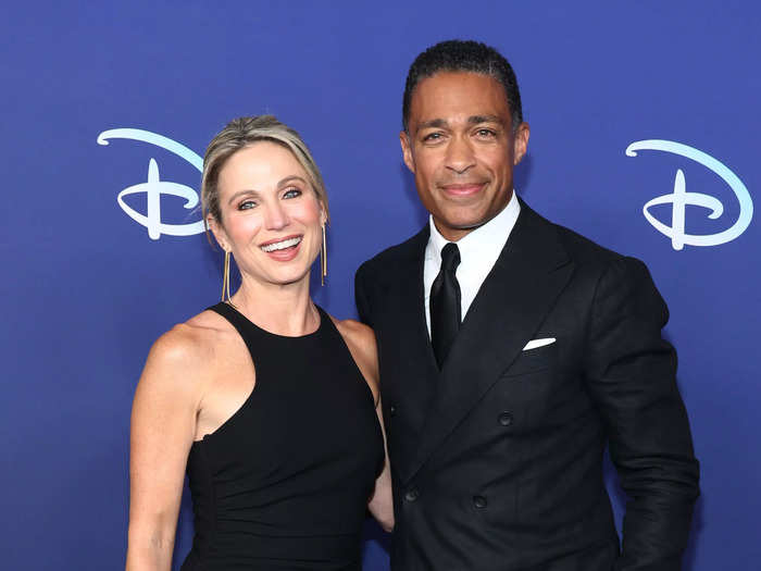 Photos emerged of "Good Morning America" co-hosts Amy Robach and T.J. Holmes seemingly acting like a couple in November 2022. At the time, they were legally married to other people.