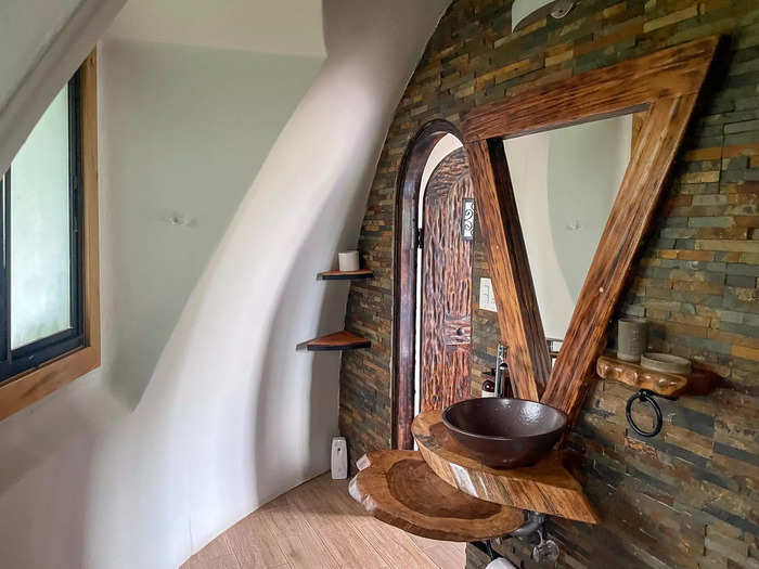 The domed bathroom had space for a sink, toilet, and shower. 