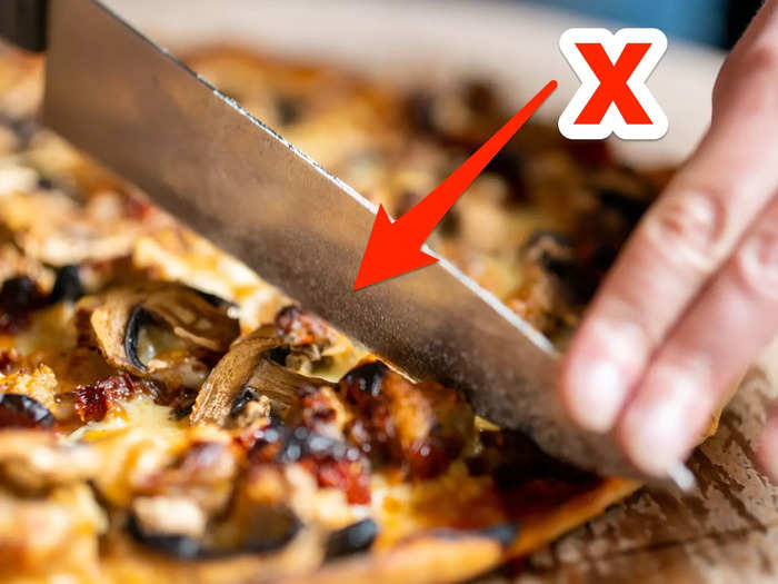 Using a knife to cut pizza can cause a big mess.