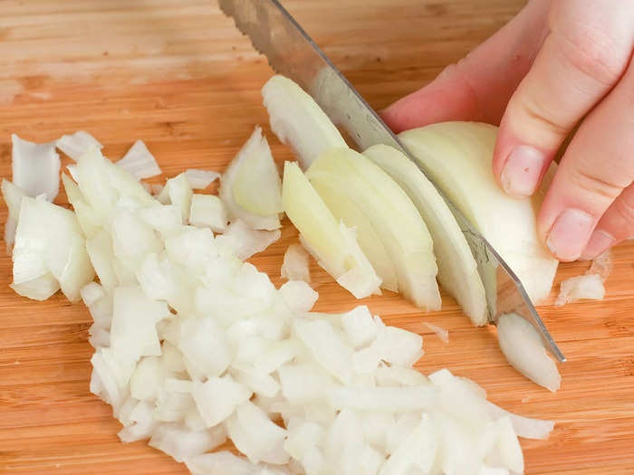 Cutting off the top of an onion can make it harder to chop.