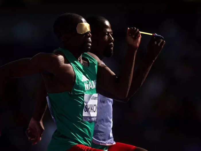 Shaw photographed Namibian runner Ananias Shikongo in sync with his guide during the men