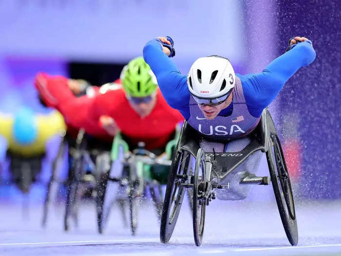 Alex Slitz placed his camera on the ground to photograph Daniel Romanchuk of Team USA in the men