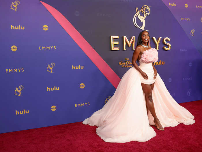 Aja Naomi King is blushing in pink. 