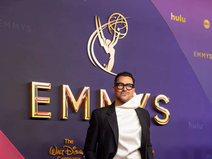 Dan Levy creates a moment on the carpet with a statement shirt. 