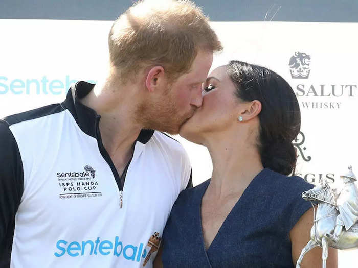 In July 2018, Meghan and Harry shared a kiss — and a trophy — after a successful Sentebale Polo match at the Royal County of Berkshire Polo Club.