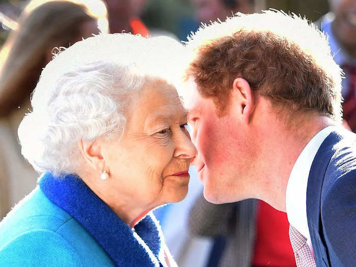 Queen Elizabeth II and Harry shared an embrace as they attended the annual Chelsea Flower Show at Royal Hospital Chelsea in May 2015.