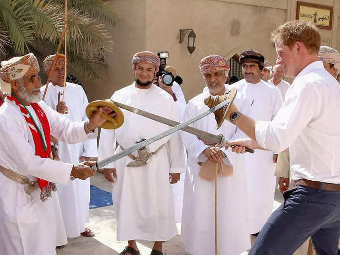 Harry was presented with a sword and shield as he met traditional Omani Dancers during a visit to Oman in November 2014.