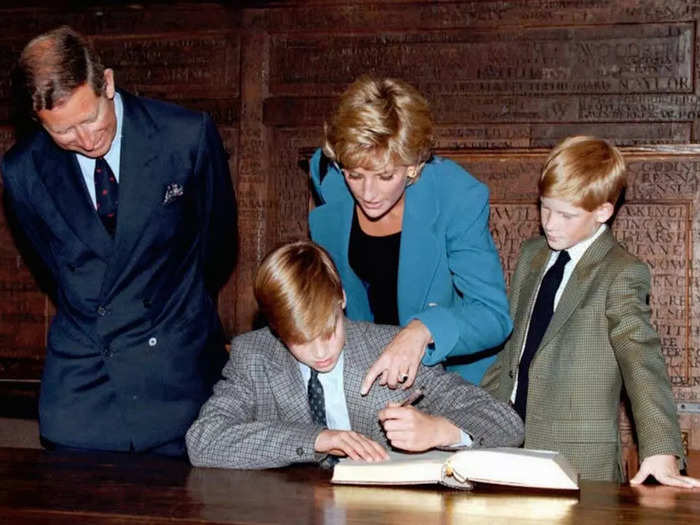 Harry looked on as Prince William signed the traditional entrance book at Eton College on his first day of school in September 1995.