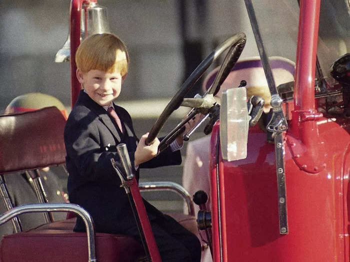 A 6-year-old Harry smiled at the wheel of a Second World War fire engine in London in October 1990.