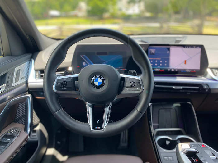 In front of the driver is a heated, leather-wrapped steering wheel. 