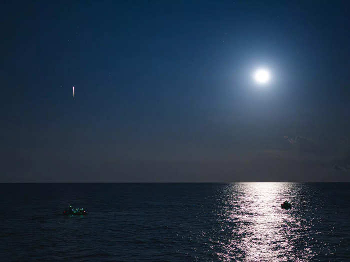 As the capsule plummeted back to Earth, the crew crossed their arms to prepare for splashdown. Parachutes deployed, and the capsule descended into the Gulf of Mexico about 70 miles from Key West.