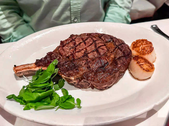 My husband ordered a cowboy ribeye and added scallops.