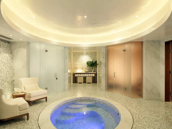 An underground spa room with a steam room, sauna, salon, and massage room.