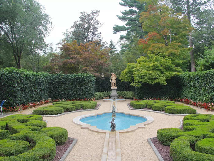 The side of the house featured a French parterre, a formal garden design dating back to the 17th and 18th centuries.