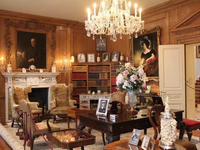 The Library on the first floor evoked 18th-century England with pine paneling and a marble mantle.