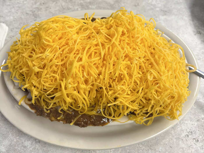 Skyline Chili piles chili and cheddar cheese on top of spaghetti.