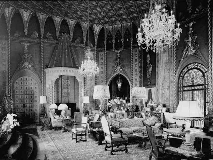 In the living room, Venetian silk panels and carved arches added to the room