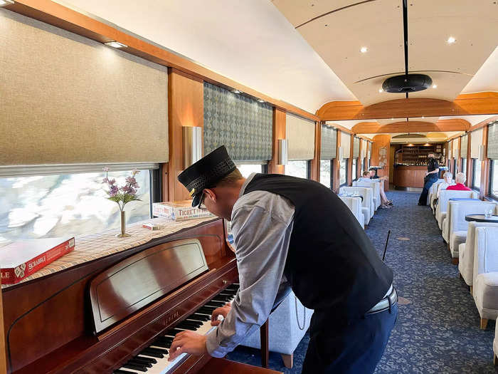 The lounge cars were welcoming and spacious environments. In one, a piano was placed in the corner with board games stacked on top.