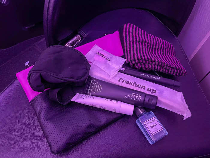 A complimentary toiletry bag full of goodies like lotion, mouthwash, and socks was waiting for me at my business-class seat.