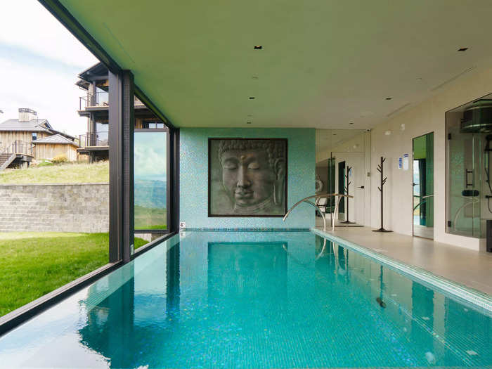 There was also an indoor pool with retractable glass windows overlooking the mountain scene.