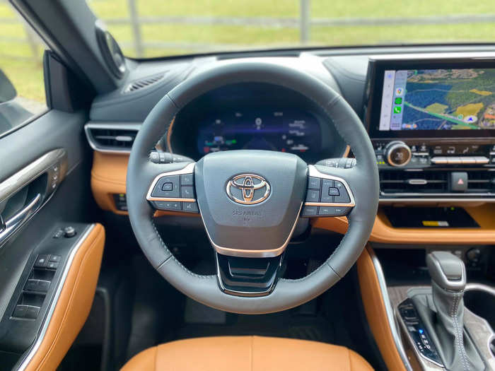 In front of the driver is a heated, leather-wrapped steering wheel. 