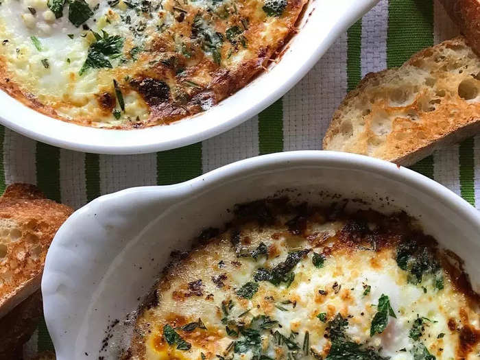 I pair herbed baked eggs with toasty bread. 