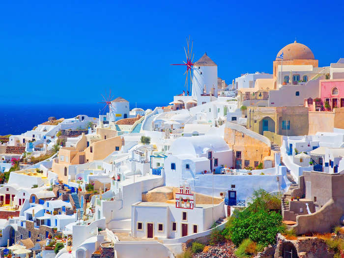 Santorini, Greece, is a picturesque spot for dancing and soaking up the sun.