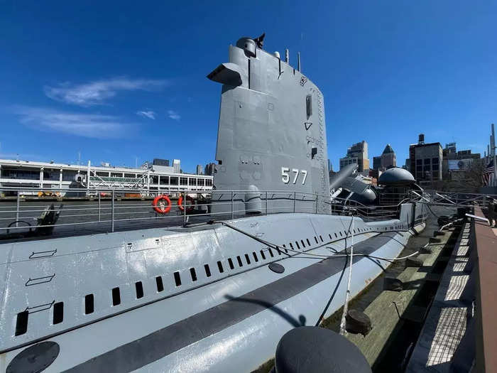 The submarine now floats in the Hudson River with its top deck visible from the dock of the museum.