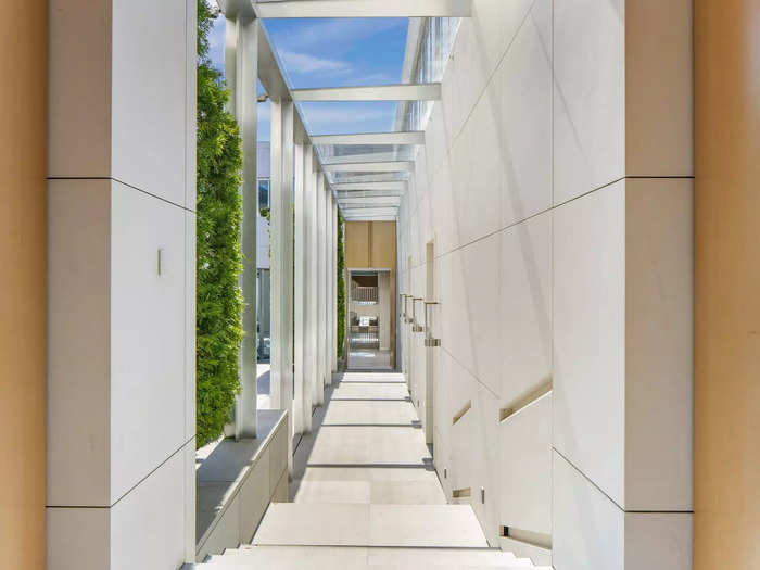 Some hallways have glass panels, so anyone walking through the house can see the views and the interior courtyard.