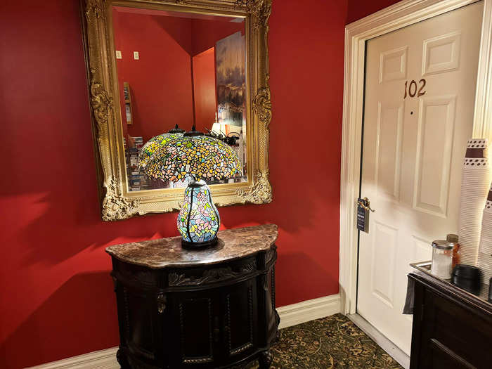 The lobby had red walls and printed carpeting throughout.