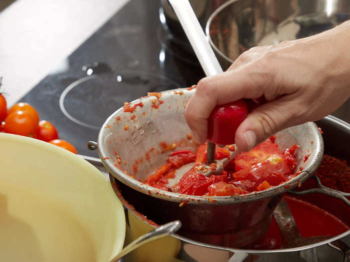 Mix tomato paste, puree, and whole roasted tomatoes to make a flavorful curry base.