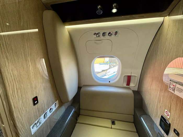 There is a lavatory and storage room in the back of the jet.