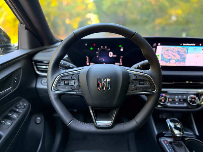 In front of the driver is a stylish flat-bottom steering wheel. 