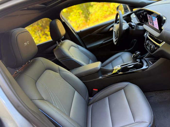 The black leatherette front seats are heated and feature Santorini Blue accents. 