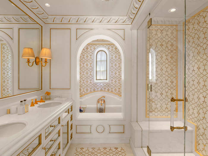 There are 18- and 24-karat gold details throughout the mansion, which has 14 full bathrooms and three half-bathrooms. 