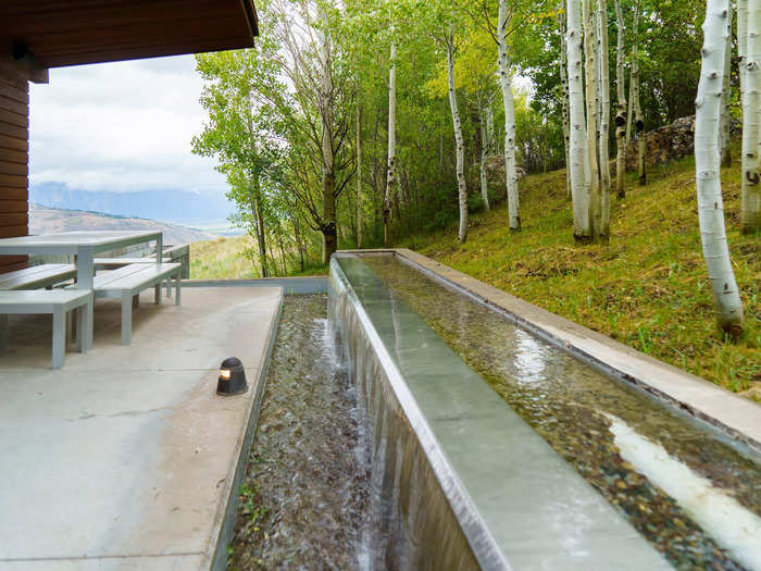 The vacation home had an outdoor water feature lining the back patios.