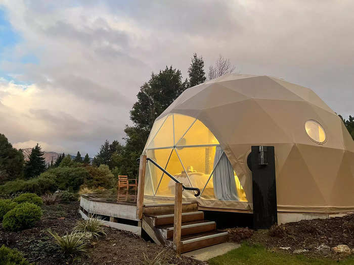 The property has six geodesic domes and a shared lodge at the edge of Lake Hawea.