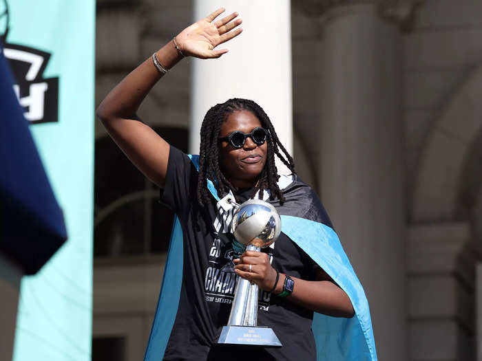 Finals MVP Jonquel Jones waved to the crowd with her trophy.