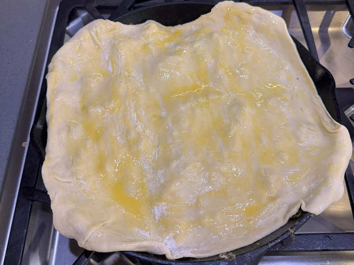 I then laid the puff pastry sheet over the skillet. 